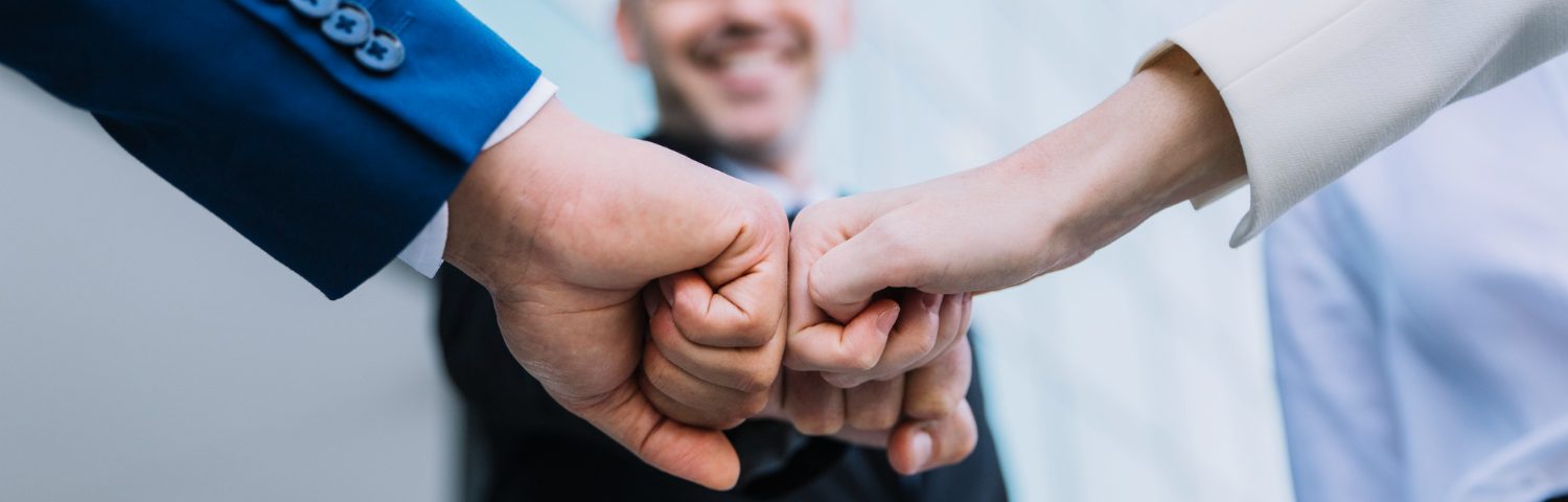 Business professional holding ISO certification, representing reliability and international standards.