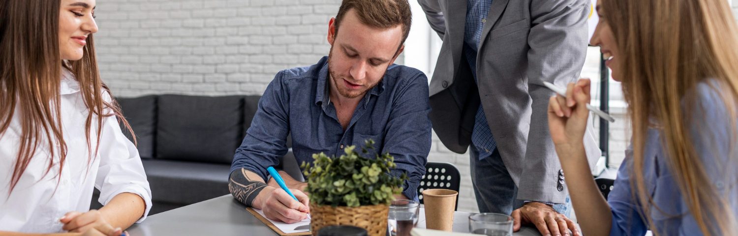 Employees finishing work early on the day before a holiday with colleagues and supervisors in an office environment